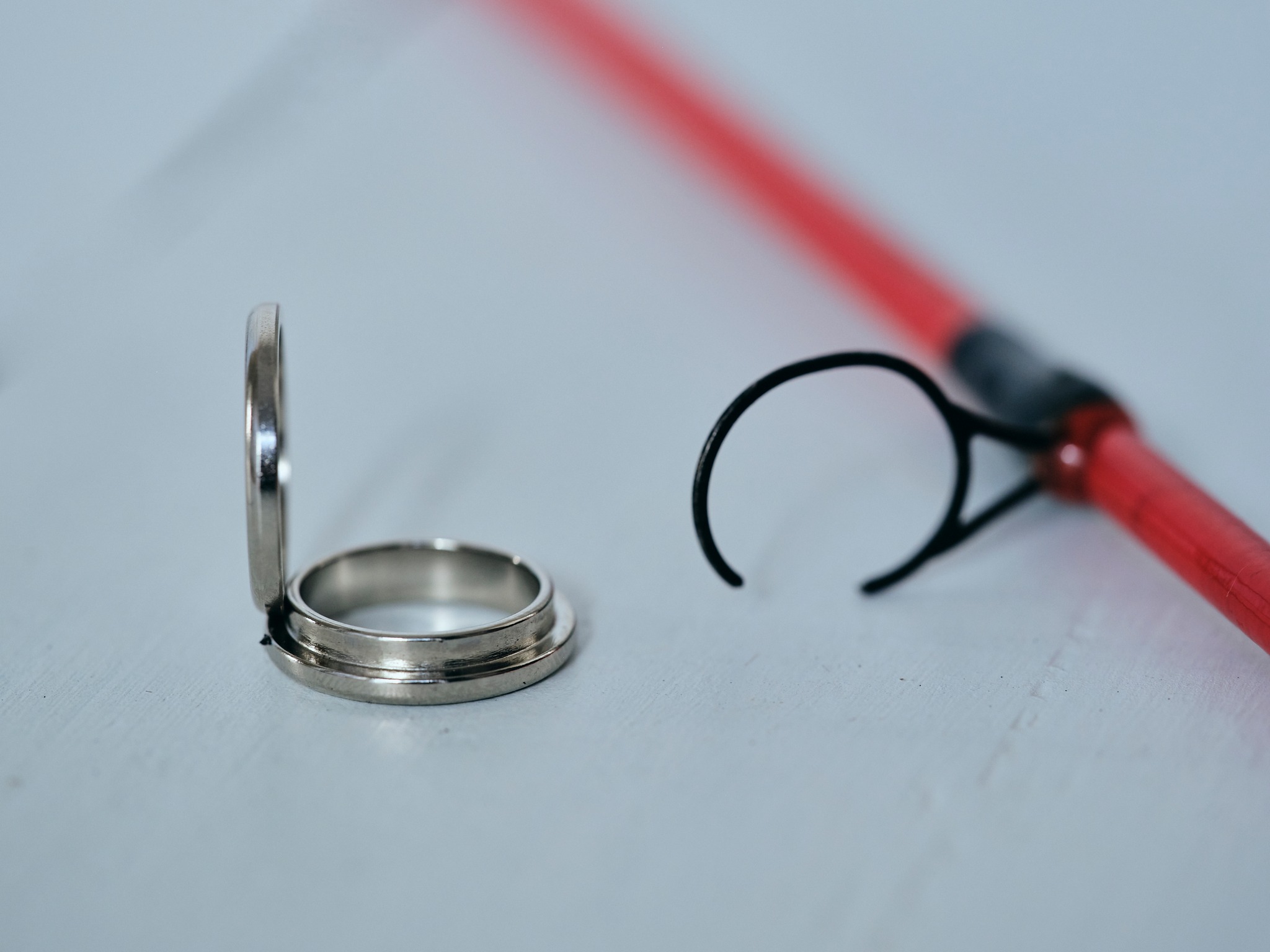 Broken Fishing Rod Guide next to a Guide2Go